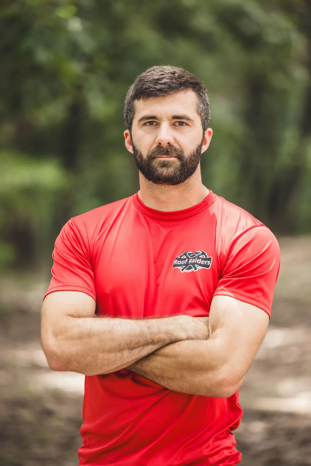Jordan Kohler standing with his arms crossed.