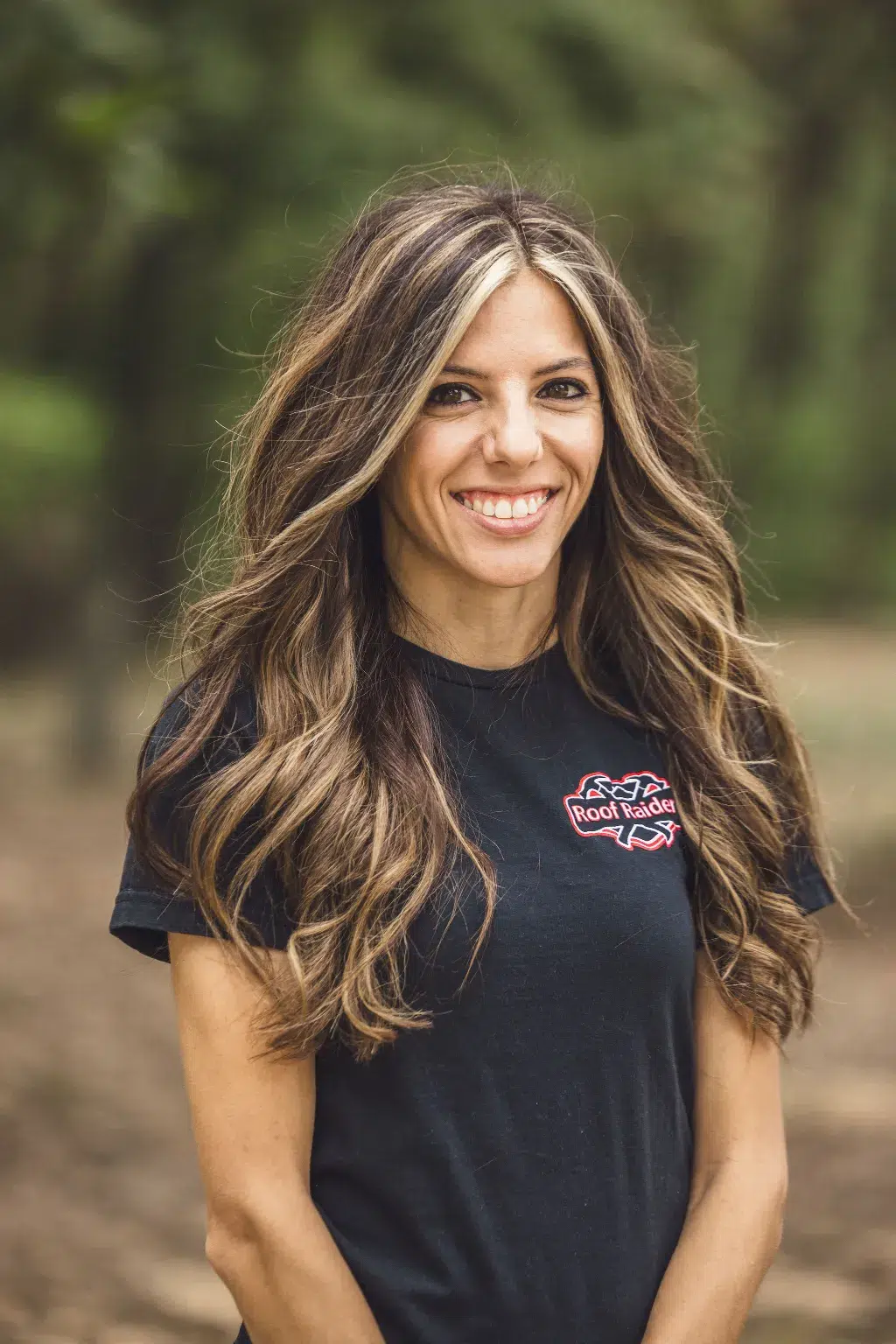Savannah Kohler standing and smiling.