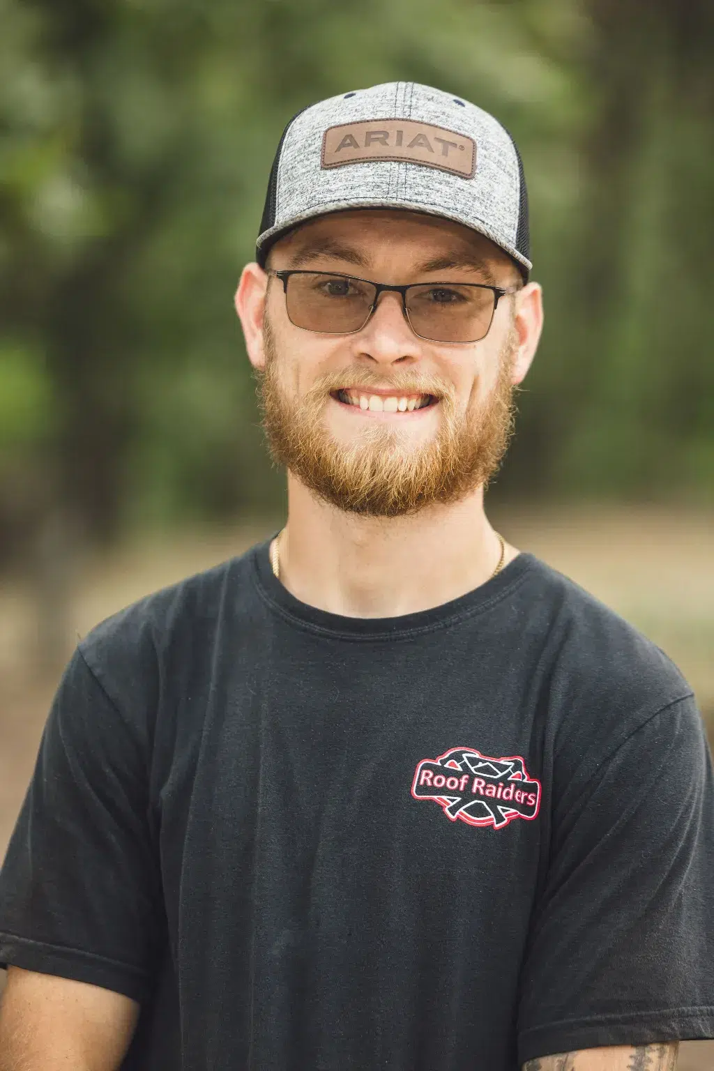 Justyn Craig standing and smiling.